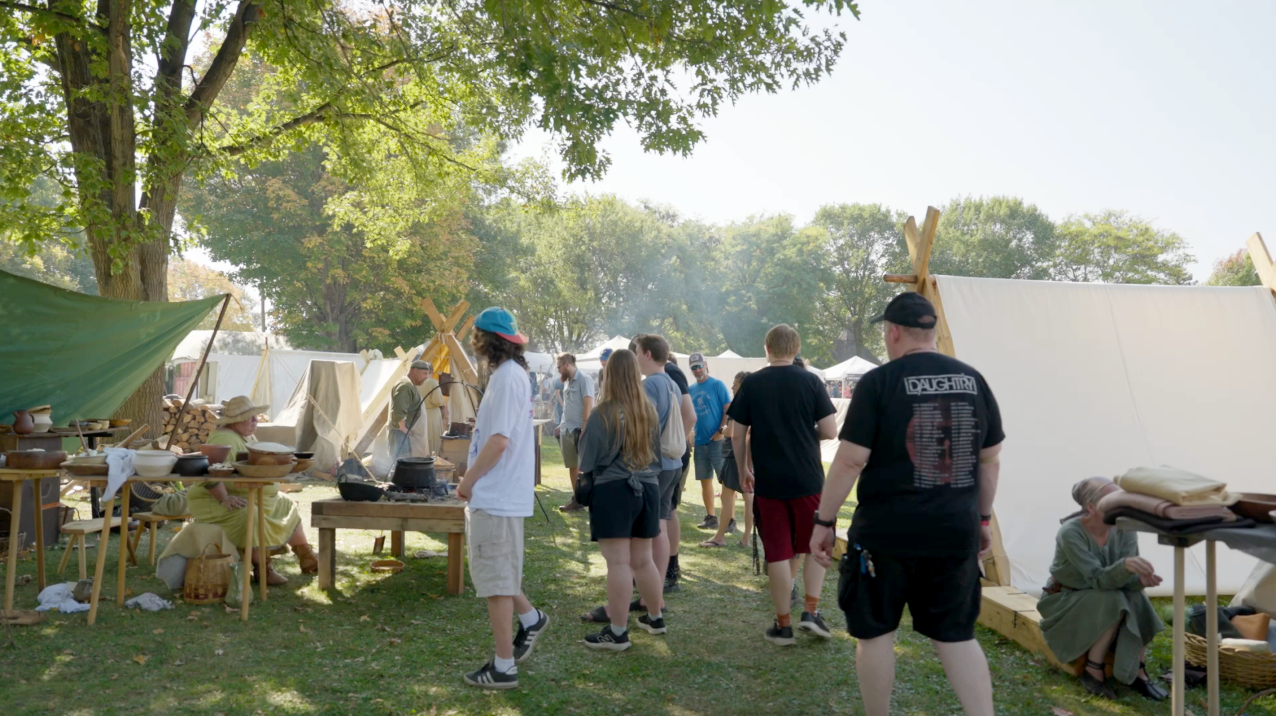 Crowd walking through the living history camp